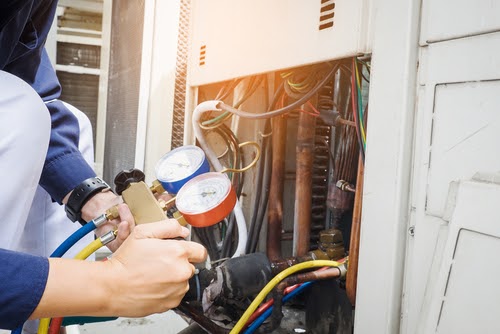 a repair technician analyzing an AC unit