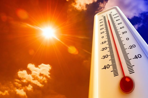 A thermometer reaching high temperatures, representing summer